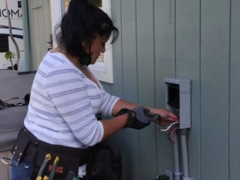 Licensed electrician wiring an exterior subpanel in Peculiar