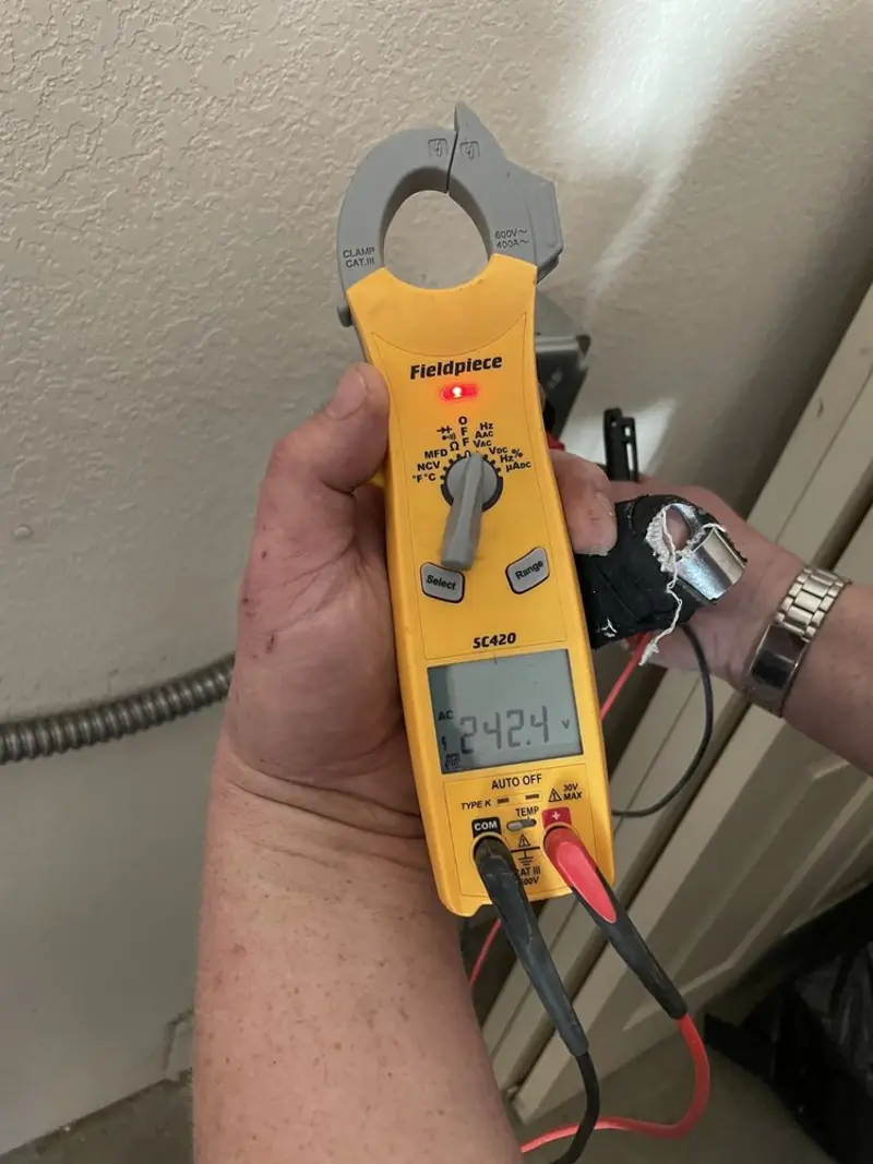 Voltage testing with clamp meter during Recessed Lighting Installation in Peculiar